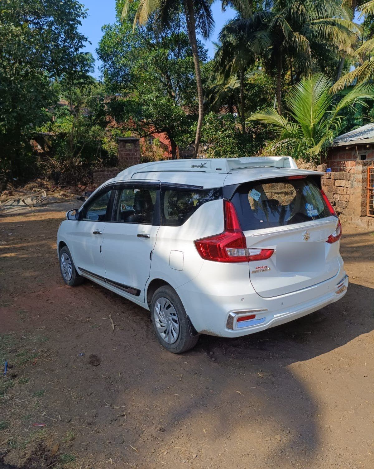 Ertiga by a laterite wall