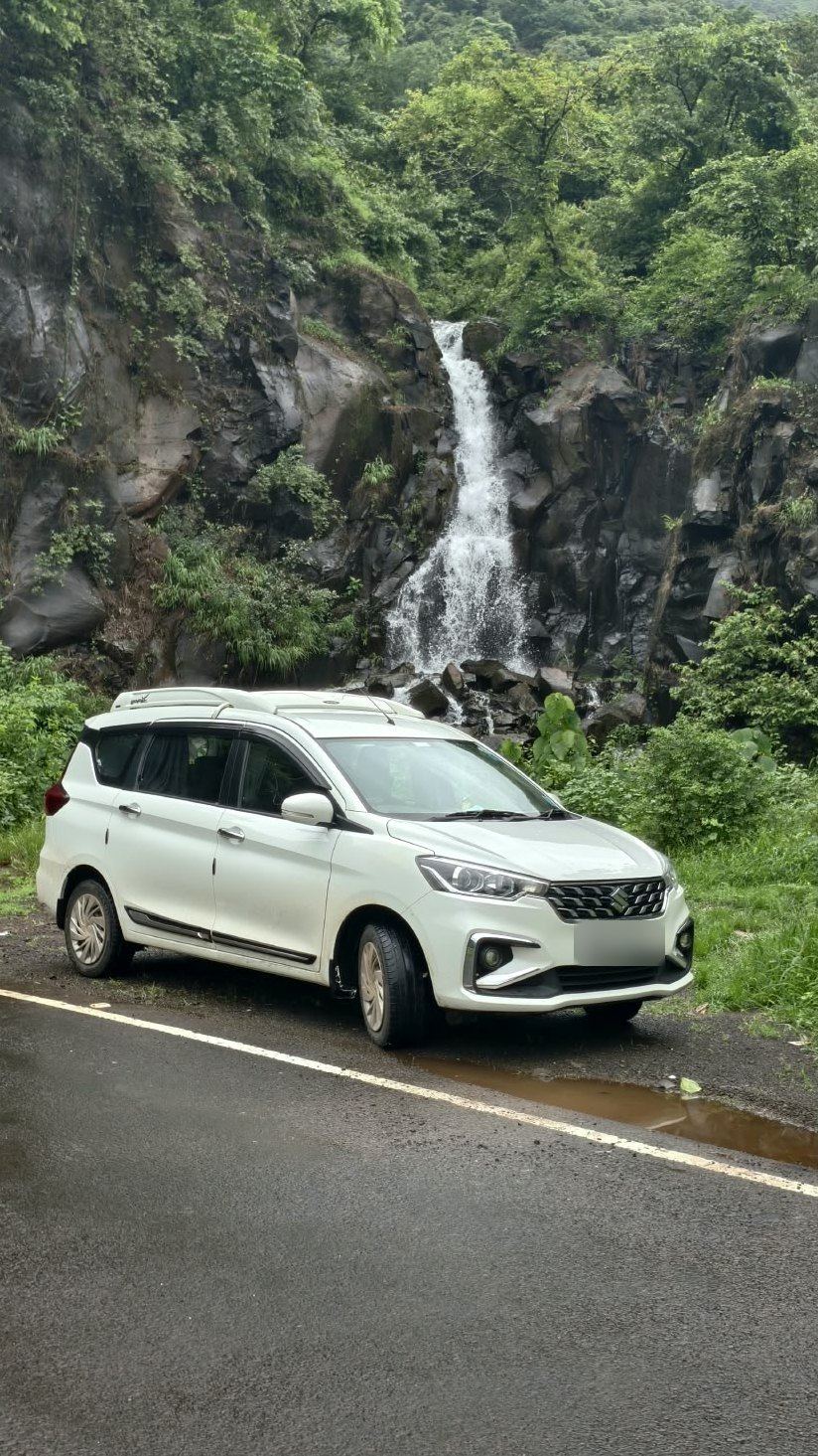 Ertiga near a monsoon waterfall